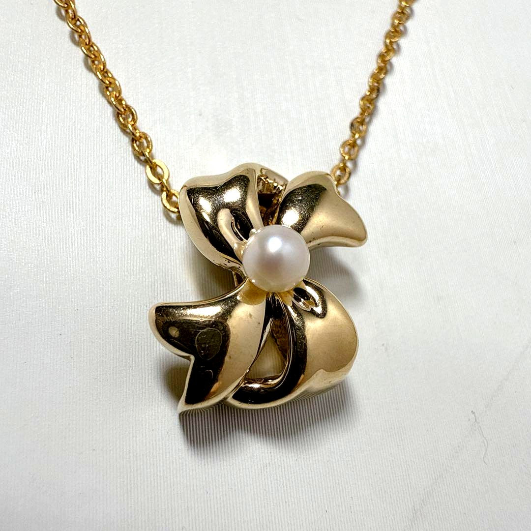 Mikimoto Gold Color Akoya Pearl Pendant with silver pendant and 16-inch chain on white background