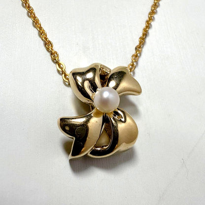 Mikimoto Gold Color Akoya Pearl Pendant with silver pendant and 16-inch chain on white background
