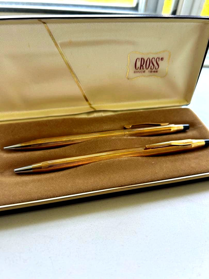 Cross pen and mechanical pencil set with two protective cases showing vintage signs of use