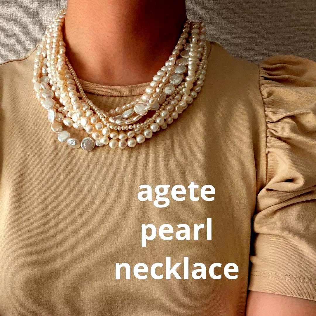 Kuro Multiple Freshwater Pearl Necklace with white freshwater pearls of different sizes on display