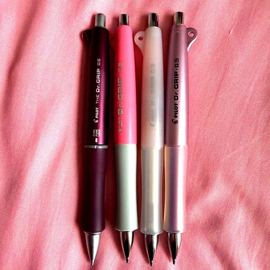 PILOT Dr. GRIP 0.5mm mechanical pencil set in pink with multiple pieces and unused erasers