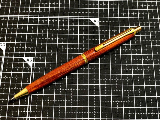 Pilot Grandee ballpoint pen with brown wooden body and gold metal accents