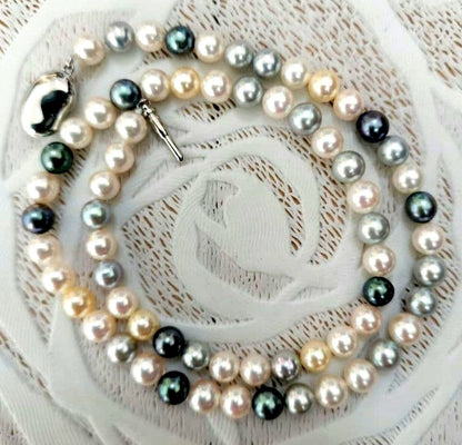 Akoya pearl necklace with 6mm round white, gold, green, and light gray pearls on a 42.5cm strand with silver push clasp