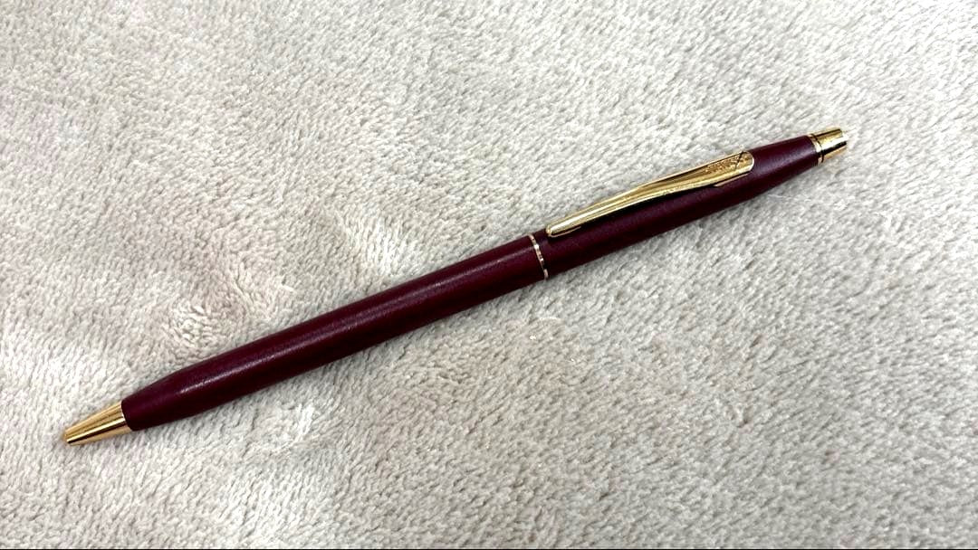 CROSS Classic Century Ballpoint Pen in burgundy with gold trim featuring a twist mechanism and conical tip