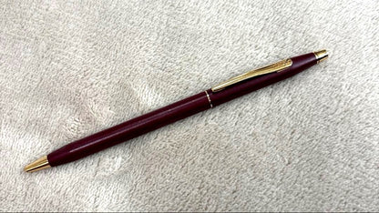 CROSS Classic Century Ballpoint Pen in burgundy with gold trim featuring a twist mechanism and conical tip