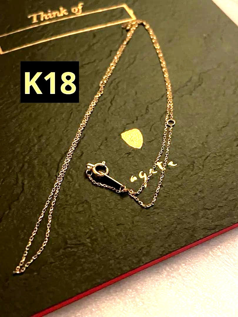 Close-up of agete K18 gold necklace chain approximately 50cm long displayed on white background
