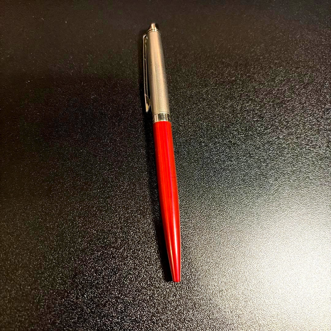 Blue ballpoint pen with smooth ink tip and ergonomic grip on white background