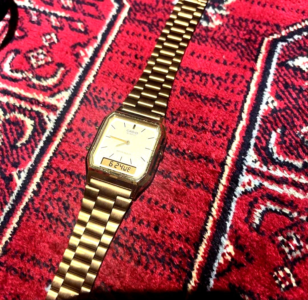 Casio AQ-230 gold watch with gold dial and band in excellent used condition