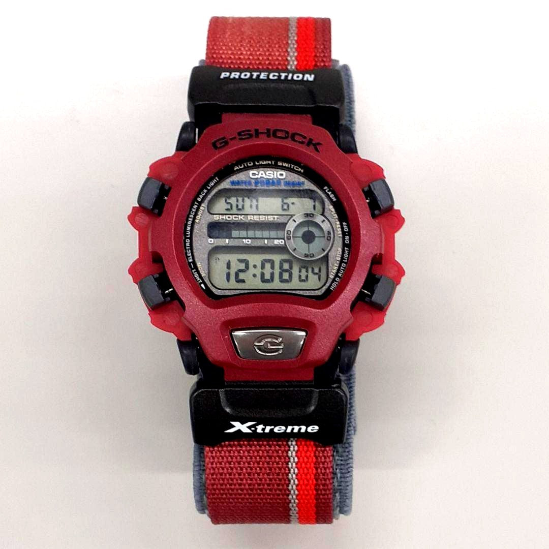 Casio DW-004 G-Shock watch with replaced battery, showing bezel damage and faded band