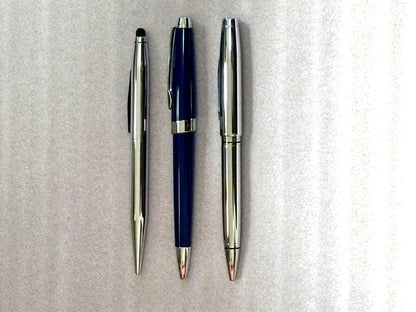 Cross ballpoint pen set of three featuring one blue resin pen and two silver metal pens with cases
