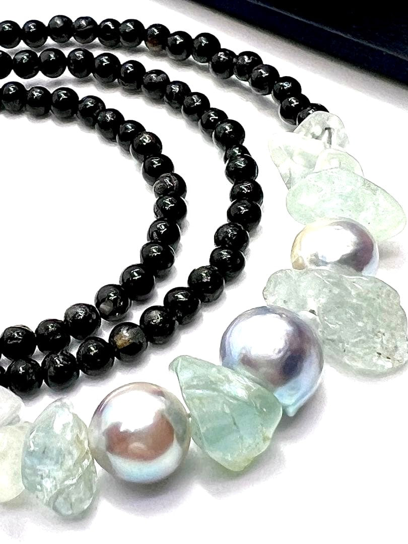 Akoya pearl necklace with natural blue pearls, aquamarine stones, and black tourmaline on a 42 to 47 cm chain