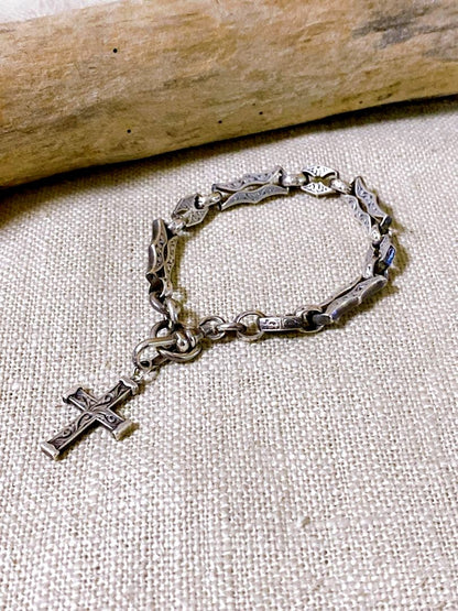 Agete Silver 925 bracelet featuring a cross motif and a pendant top on a white background