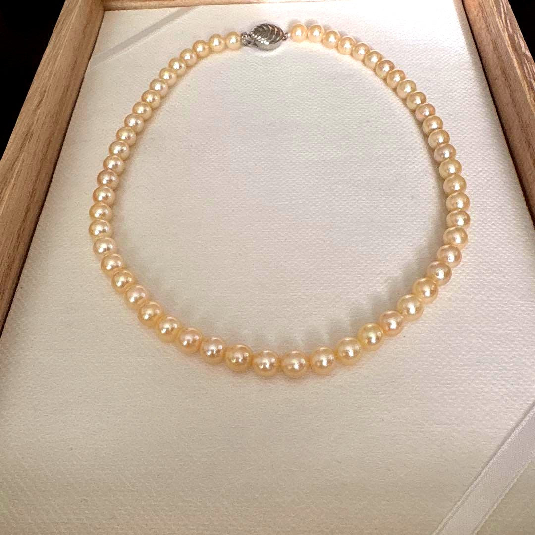 Single strand Akoya genuine pearl necklace with 7mm cream tone pearls and silver clasp