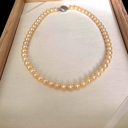 Single strand Akoya genuine pearl necklace with 7mm cream tone pearls and silver clasp