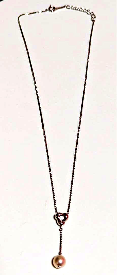 Tasaki pearl necklace with sterling silver chain and 0.01 carat diamond pendant, medium pearl, lobster clasp