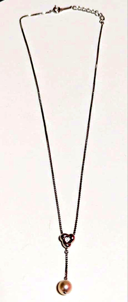 Tasaki pearl necklace with sterling silver chain and 0.01 carat diamond pendant, medium pearl, lobster clasp