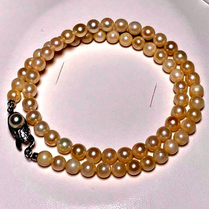 Close-up of Ise-Shima white Akoya pearl necklace with 5.4-5.9mm round pearls and silver clasp