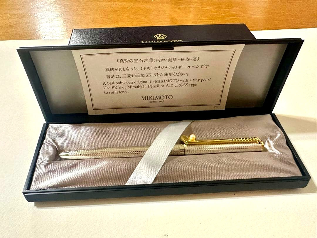 Mikimoto ballpoint pen decorated with pearls, shown with box and description card