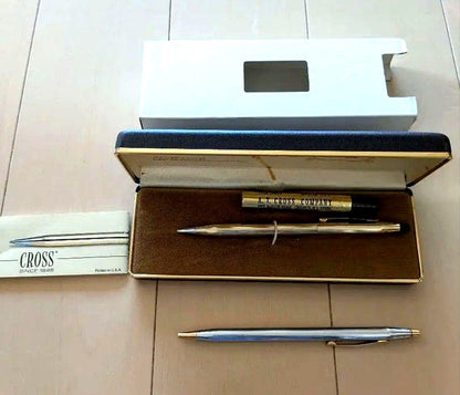 CROSS set of gold mechanical pencil and silver ballpoint pen displayed with black case and instruction manual