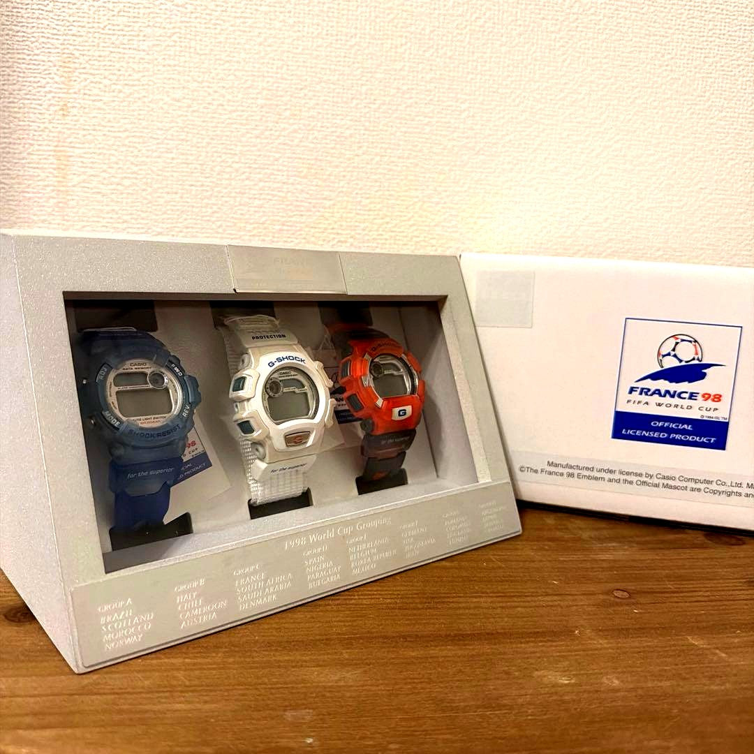 Casio G-Shock FIFA World Cup 1998 limited edition 3-piece watch set with blue, white, and red watches in display case