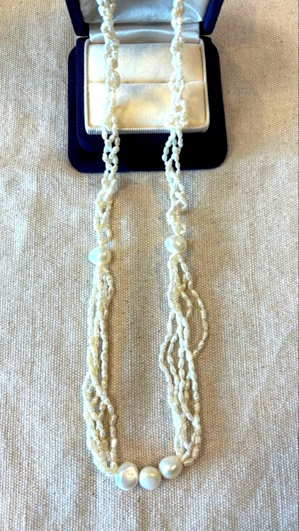 Agete freshwater pearl necklace made of K10 gold with a 60 cm length displayed on a white background