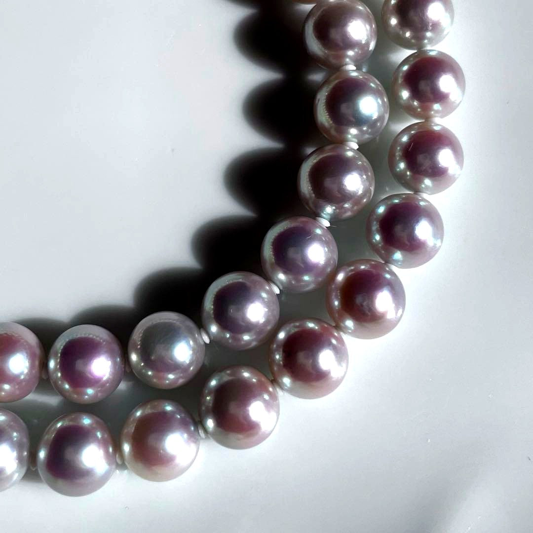 Akoya pearl necklace with 7.5-8mm blue tone pearls and silver clasp displayed with certification and box