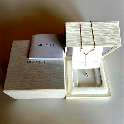 Mikimoto Akoya pearl necklace with 7.5mm pearl and small diamonds on 18K pink gold chain, 50cm length