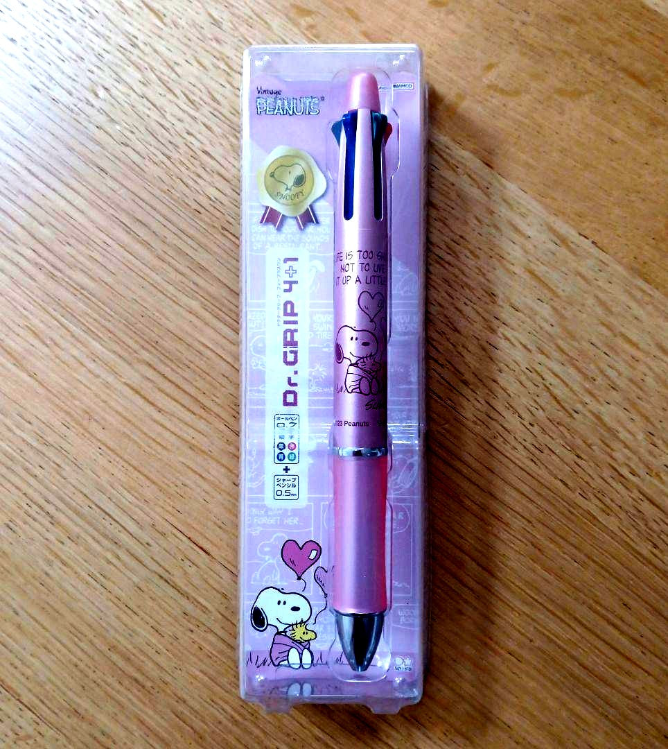 Pilot Snoopy Dr. Grip 4+1 multi-function pen in pink with Snoopy and Woodstock design