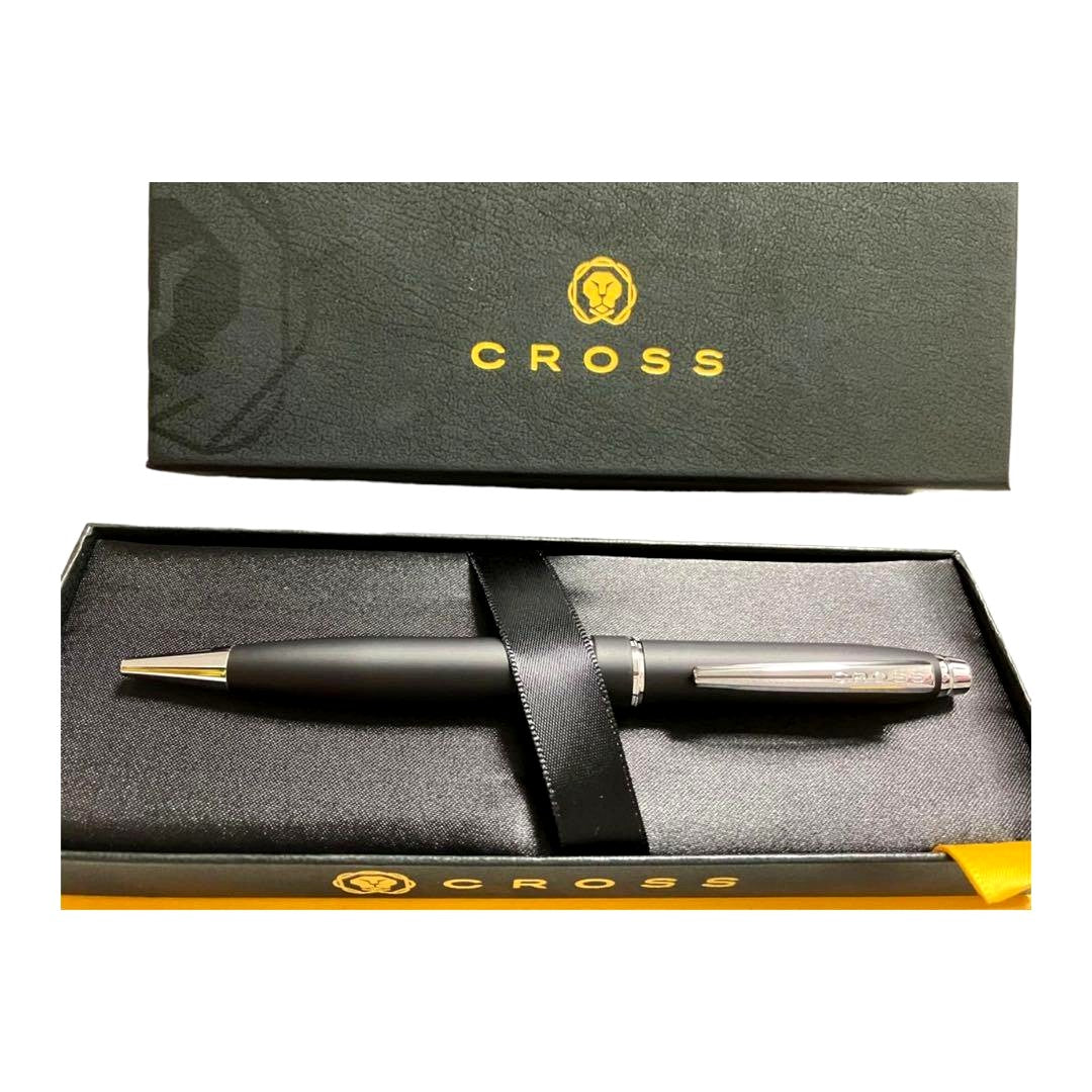Cross ballpoint pen in matte black finish with silver accents and black ink, shown with original box