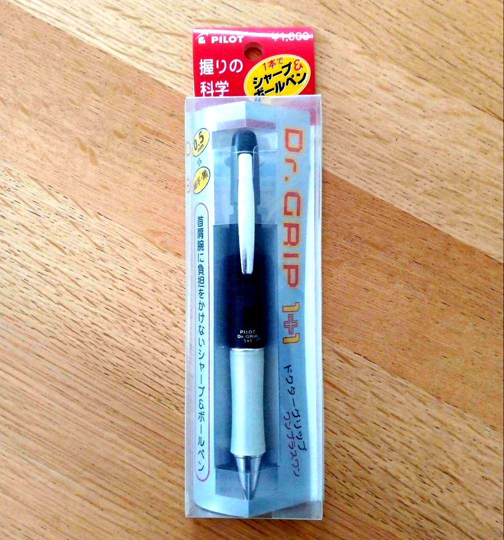 Pilot Dr. Grip 1+1 black multi-function pen with 0.5mm tip, new and unused, shown with packaging
