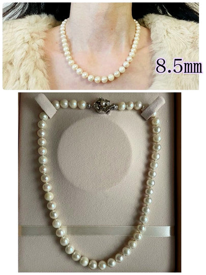 Aukoya pearl necklace with large 8.5mm round pearls and silver princess clasp on a white background