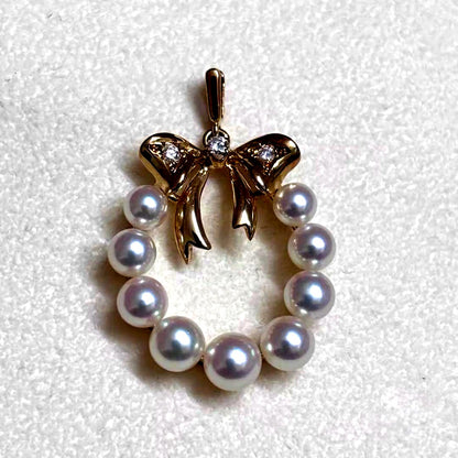 Mikimoto K18 gold pendant top shaped like a ribbon with pearl and diamond decorations