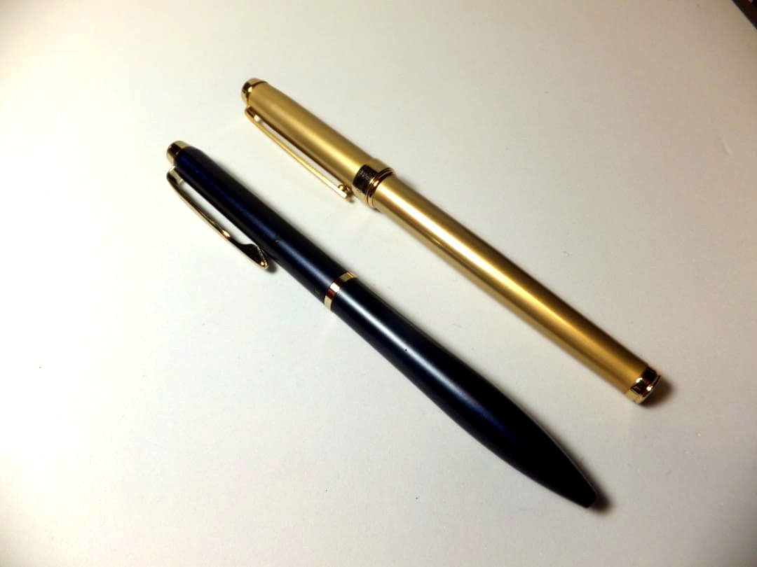 Used PILOT DRIVE ballpoint pen in navy color shown from side view
