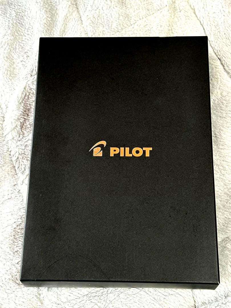 Pilot Multi-Function Pen Z-GR-SBN showing black, red, and blue ink pens plus mechanical pencil with case and box