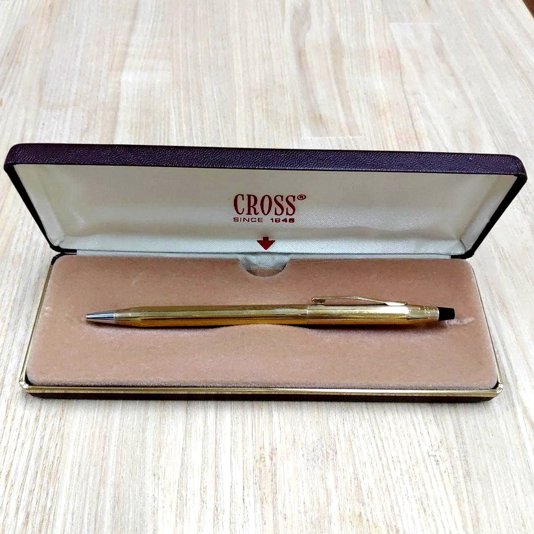 Cross gold ballpoint pen made of metal displayed with its protective case