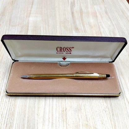 Cross gold ballpoint pen made of metal displayed with its protective case