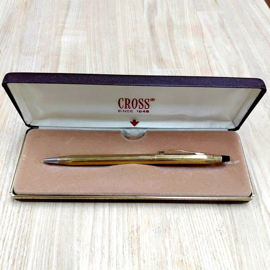 Cross gold ballpoint pen made of metal displayed with its protective case