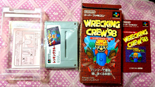 SNES Recking Crew 98 game cartridge with original box and manual showing slight wear on outer box