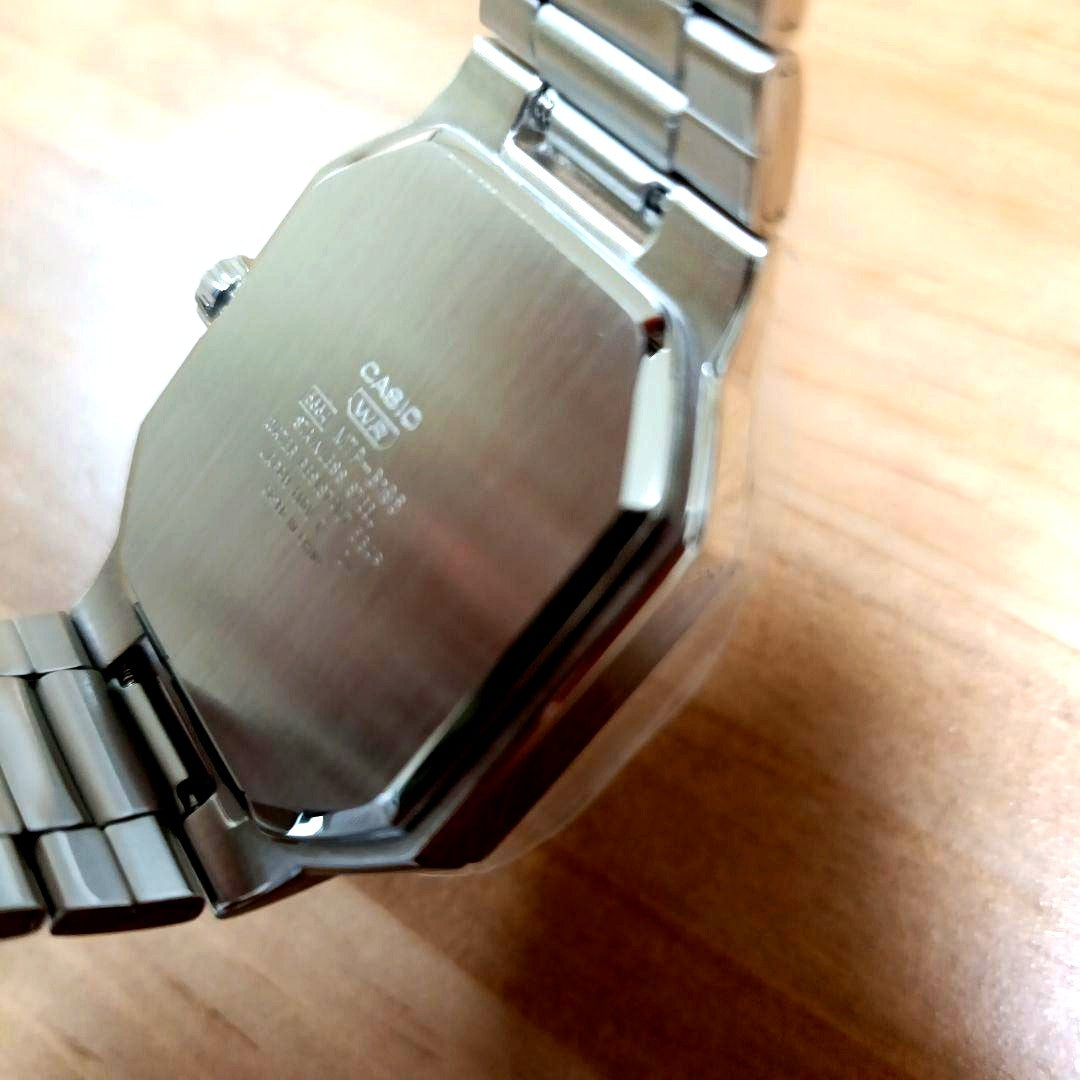 Casio MTP B195D silver wristwatch with metal band and clear dial, packaged and ready for shipment
