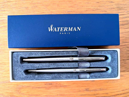 WATERMAN Paris ballpoint and rollerball pen set in silver stainless steel finish with included box