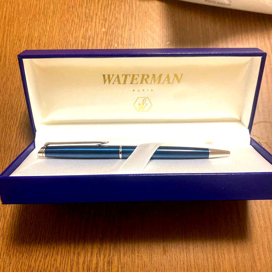 Waterman blue ballpoint pen with sleek silver accents and matching dedicated case on a white background