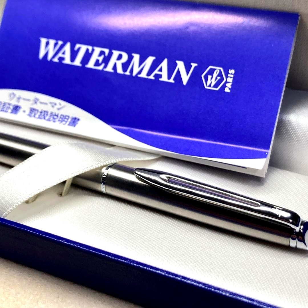 Waterman ballpoint pen with silver metal body, twist mechanism, black ink, and matching silver case