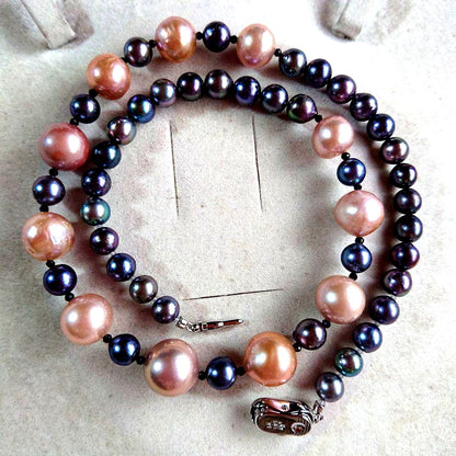 Law pearl necklace 44.5 cm long with 6 to 11 mm sized pearls displayed on white background