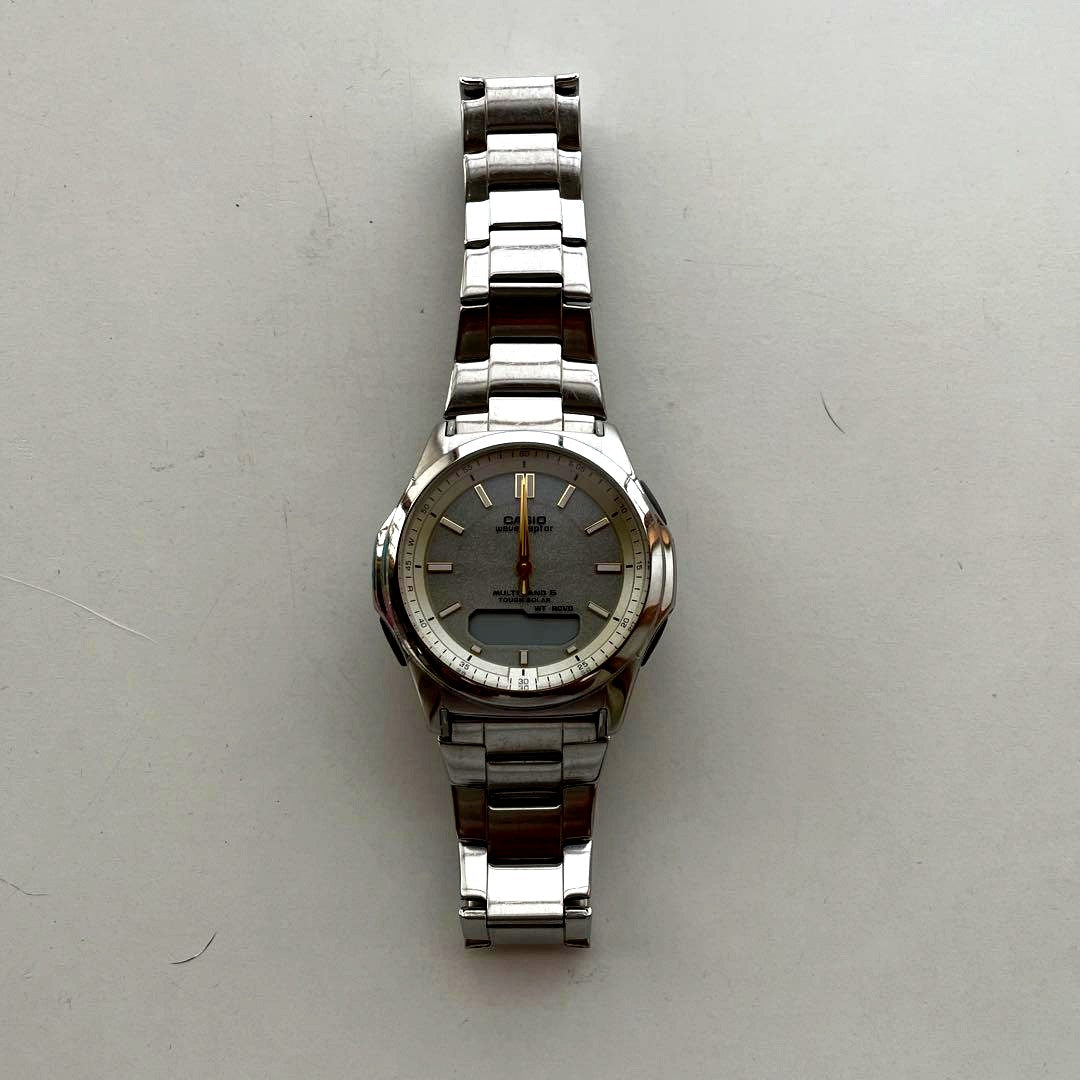 Casio WV13FB10GLD radio-controlled sports watch with digital and analog display, gold-tone case, and black strap