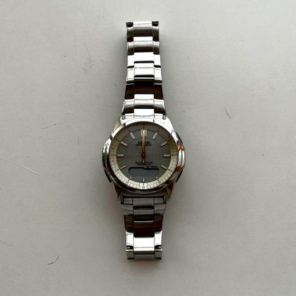 Casio WV13FB10GLD radio-controlled sports watch with digital and analog display, gold-tone case, and black strap