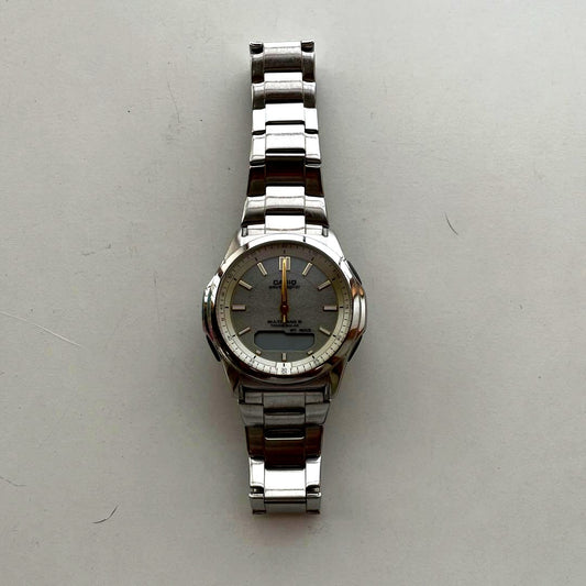 Casio WV13FB10GLD radio-controlled sports watch with digital and analog display, gold-tone case, and black strap