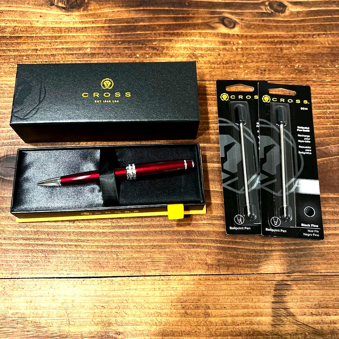 Two unused Cross ballpoint pen replacement refills without packaging on a white background