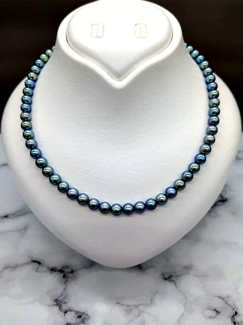 Akoya black pearl necklace featuring 7mm light peacock South Sea pearls with silver clasp, 42.3 cm length