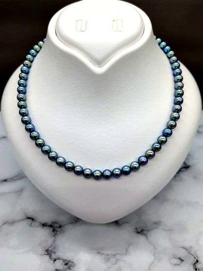 Akoya black pearl necklace featuring 7mm light peacock South Sea pearls with silver clasp, 42.3 cm length