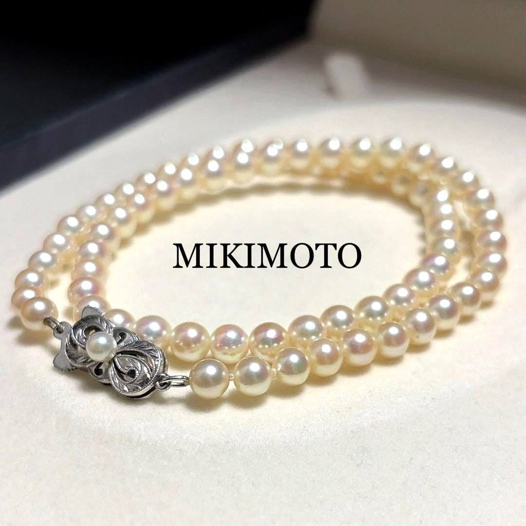 Mikimoto Akoya Pearl Necklace with 5.5mm baby pearls and high luster on a white background
